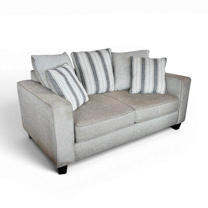 Tan 2 Seater Couch with Striped Pillows