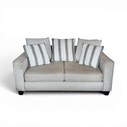 Tan 2 Seater Couch with Striped Pillows