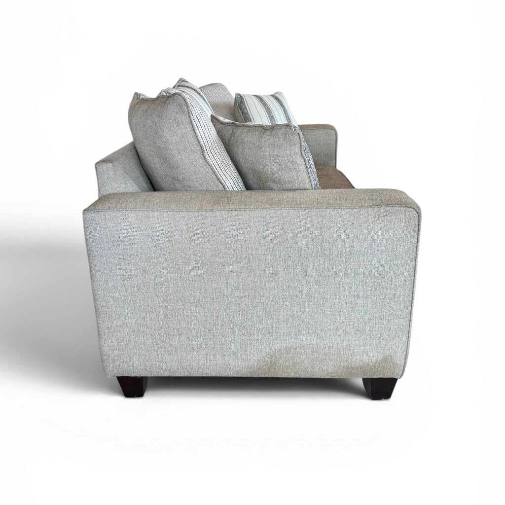Tan 2 Seater Couch with Striped Pillows