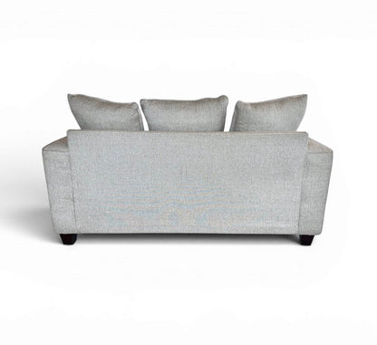 Tan 2 Seater Couch with Striped Pillows