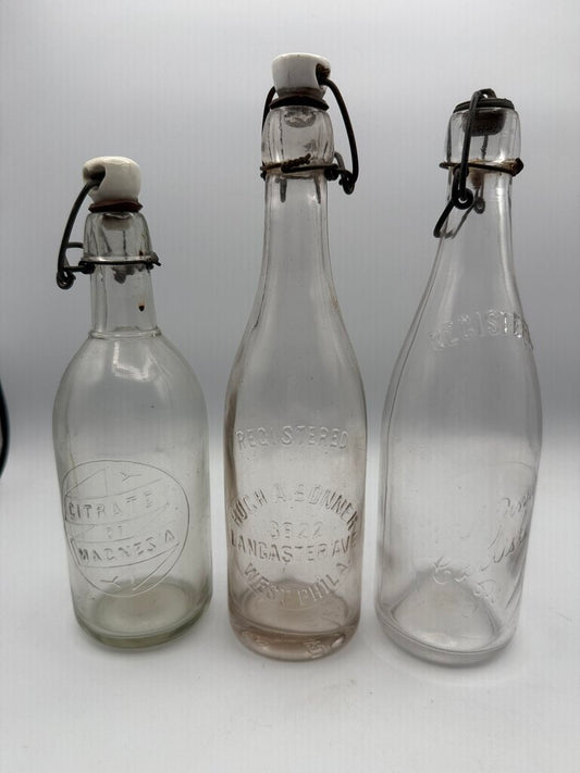 Set of 3 Antique Embossed Glass Bottles with Stoppers /ro