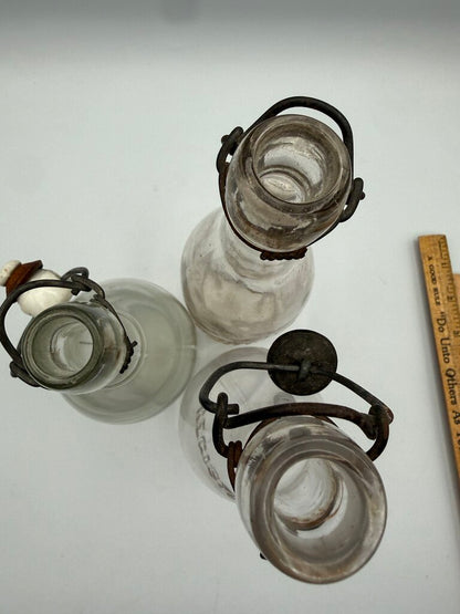 Set of 3 Antique Embossed Glass Bottles with Stoppers /ro